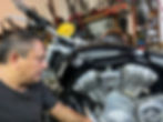 Hector working on a motorcycle
