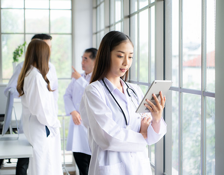 portrait-female-medical-team-discuss-case-study-involving-disease-therapy.jpg