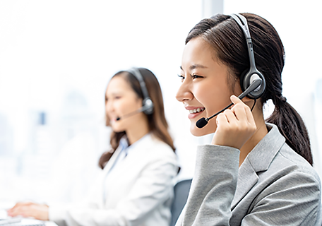 smiling-telemarketing-asian-woman-working-call-center-office.png