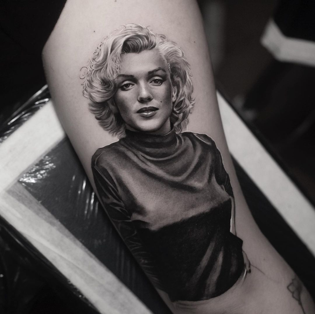 black and grey celebrity portrait tattoo