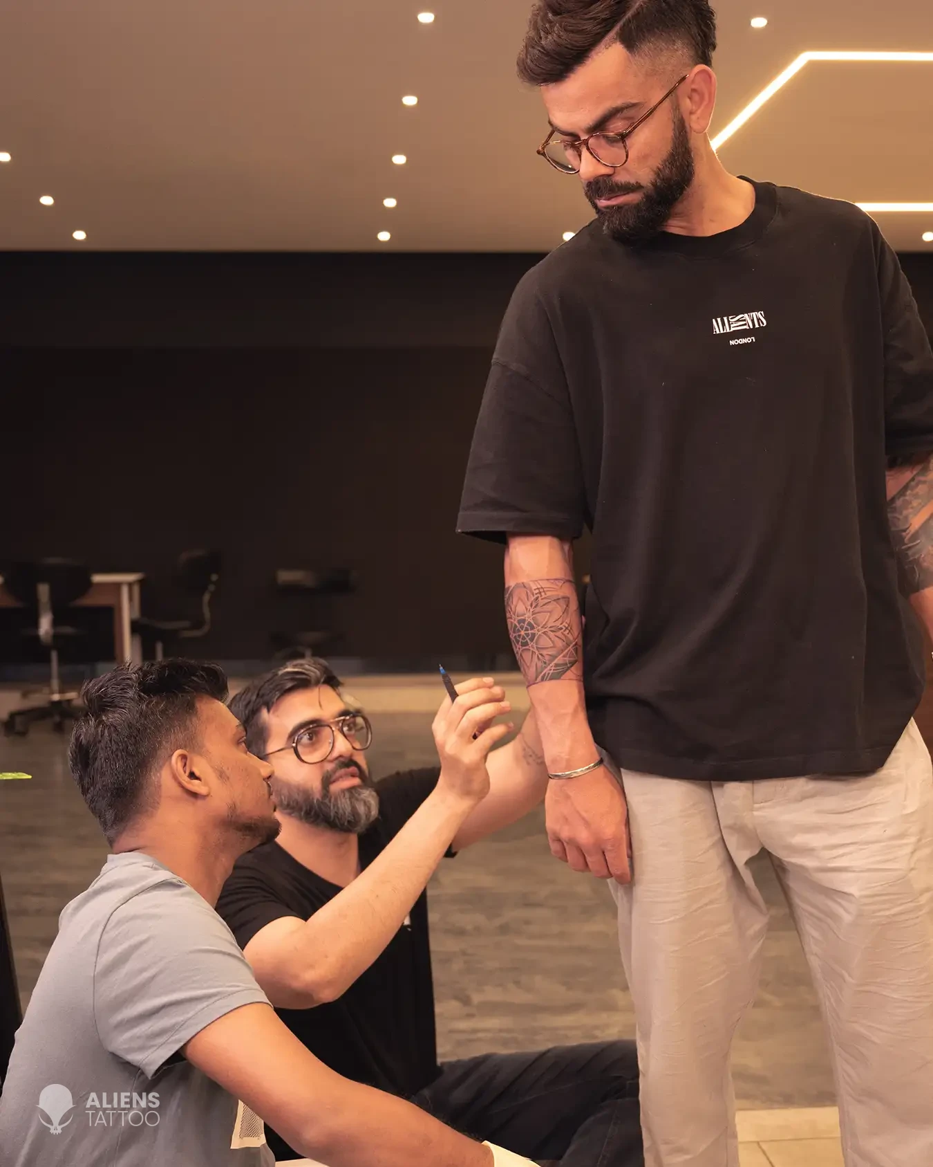 Virat Kohli's tattoo showcasing interconnectedness and spiritual symbolism