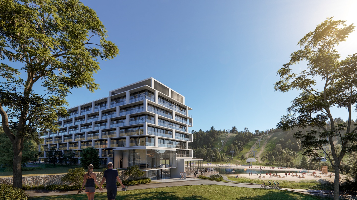 Exterior view of the finished Horseshoe Residences condominium building with surrounding scenery.