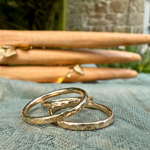 A stack of hammered gold filled 2mm rings