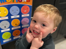 Smiling boy with emotions poster