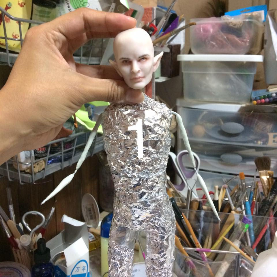 Close-up view of polymer clay blocks in various colors arranged on a wooden table