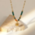 Golden sun pendant necklace featuring green and orange beads, 9to5Jewels.
