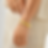 Woman wearing gold bracelet on her wrist with white dress 9to5Jewels