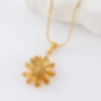 Golden daisy pendant necklace on white background, 9to5Jewels jewelry