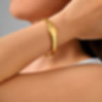 Woman's arm with gold bracelet close up 9to5Jewels elegant accessory