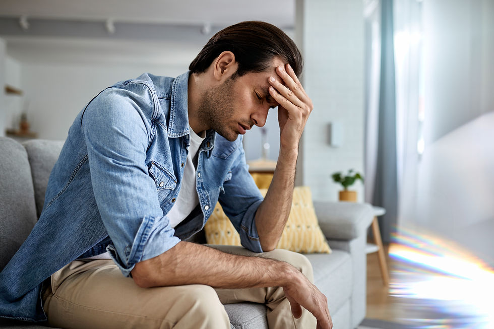 young-man-having-headache-holding-his-head-pain-home.jpg