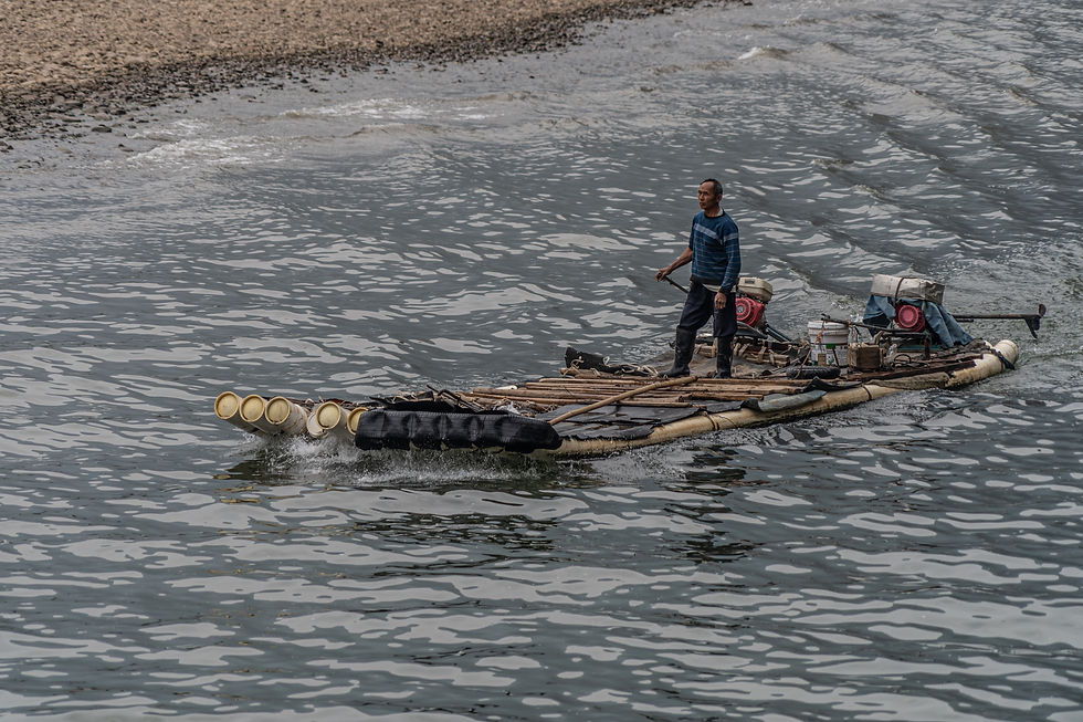 Man on Bamboo boat