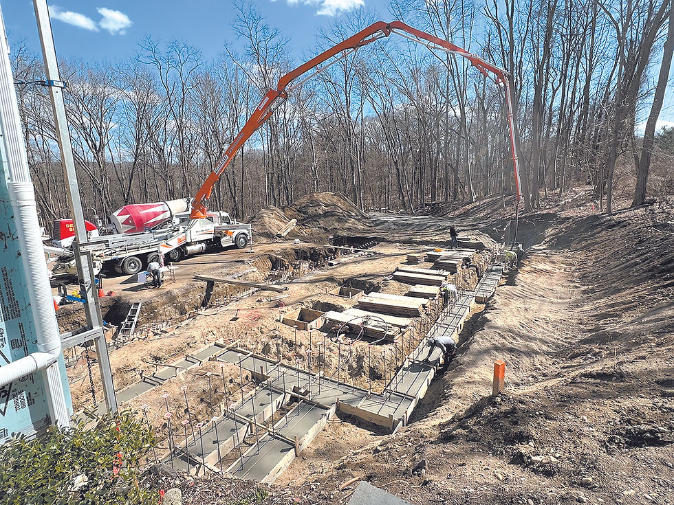 Laying concrete for the new addition’s foundation.