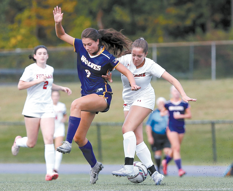 Above, Natalie Mazzucca of Fox Lane stops Carly Mangiaracina of John Jay. Below, Fox Lane goalie Dylan New makes diving save. Photos by Jim MacLean