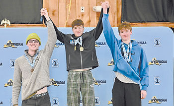 ohn Jay’s Porter Bysshe (right) finished second in the overall Skimeister standings at the Section 1 boys ski championships. Derrick Crivelli (center) of Brewster, son of John Jay coach Paul Crivelli, was first. Jack Mooney (left) of Yorktown was third.