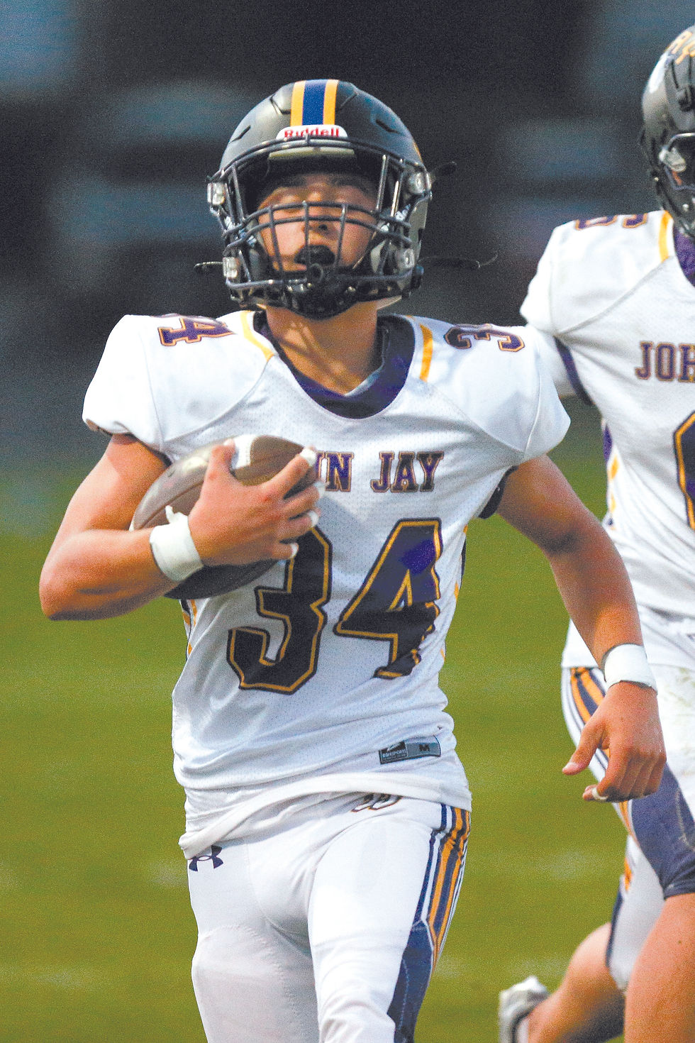 Chase Carvajal carries after an interception for the Wolves.