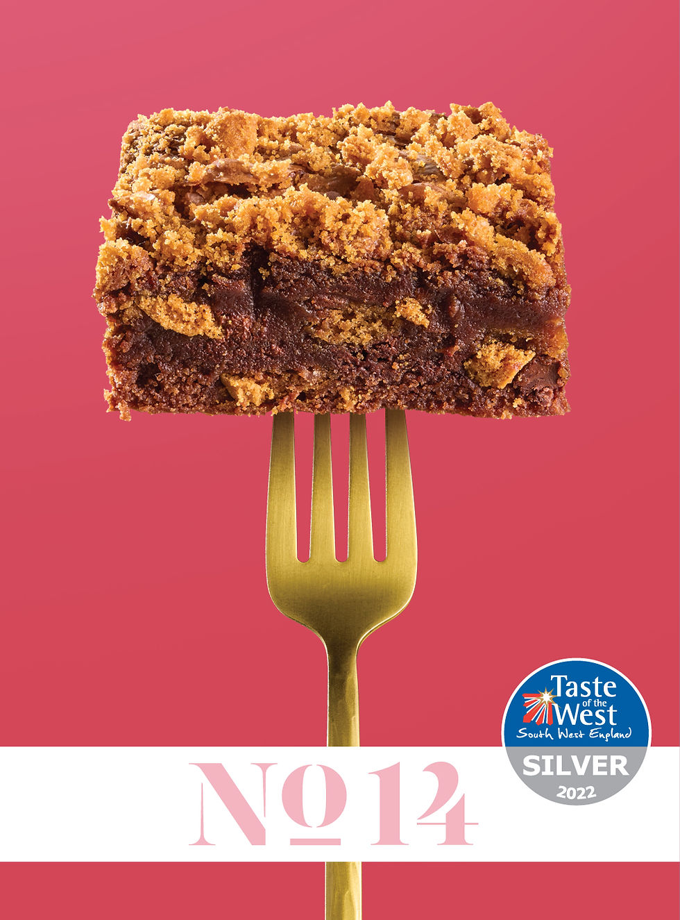 square of chocolate brownie with biscoff pieces held up on a gold fork