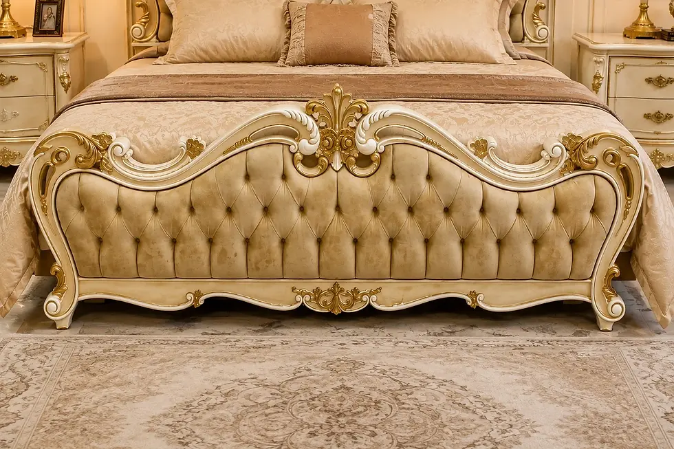 Carved teak wood footboard on Victorian-style bed
