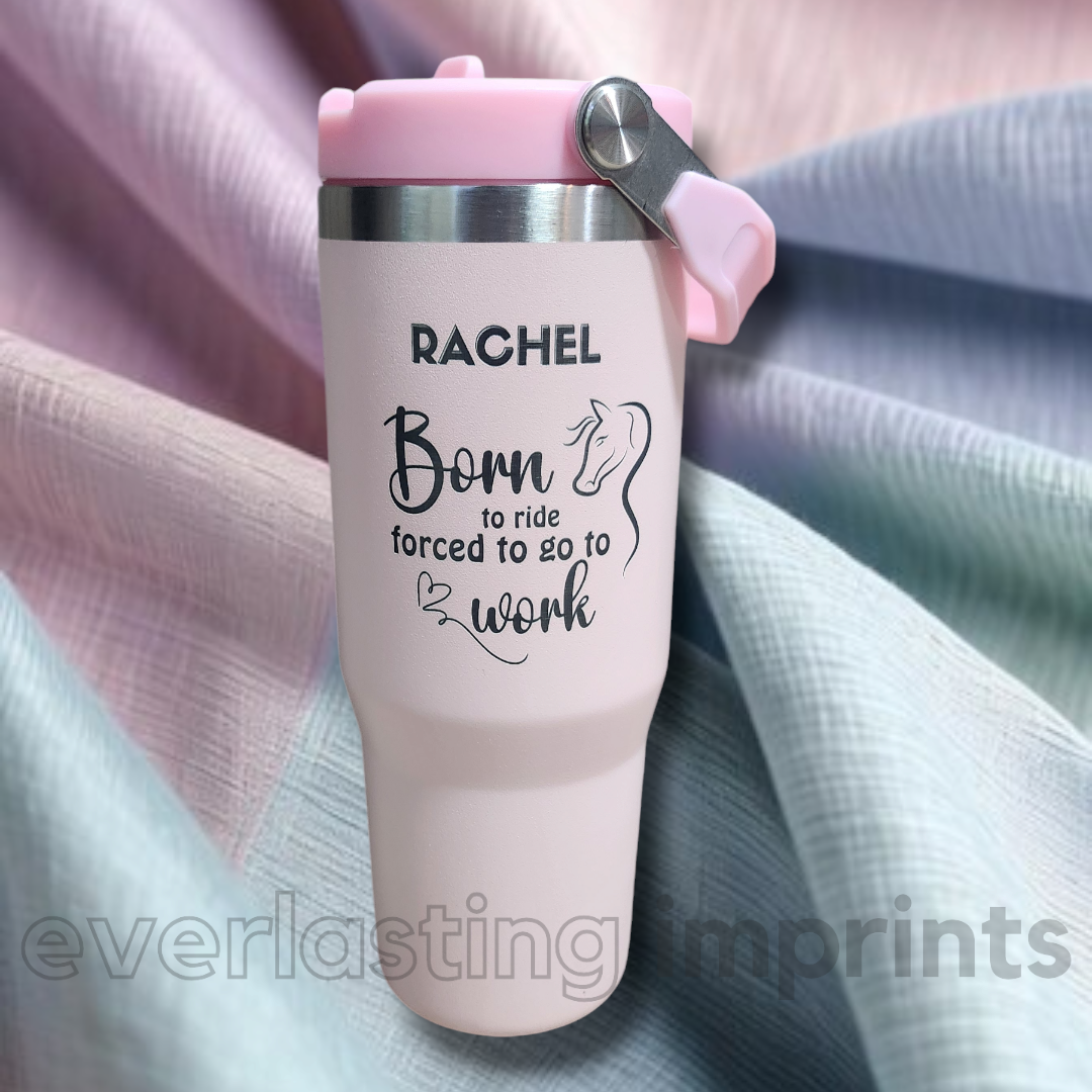 Image is of a 30oz tumbler with various designs relating to the equine world engraved on it.