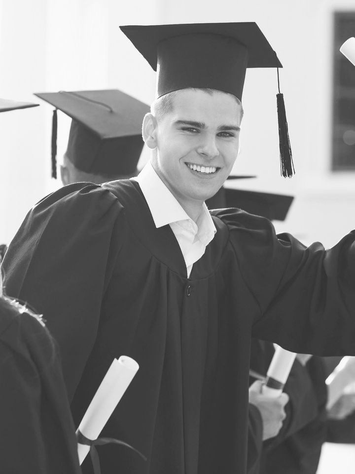Graduate holding a diploma