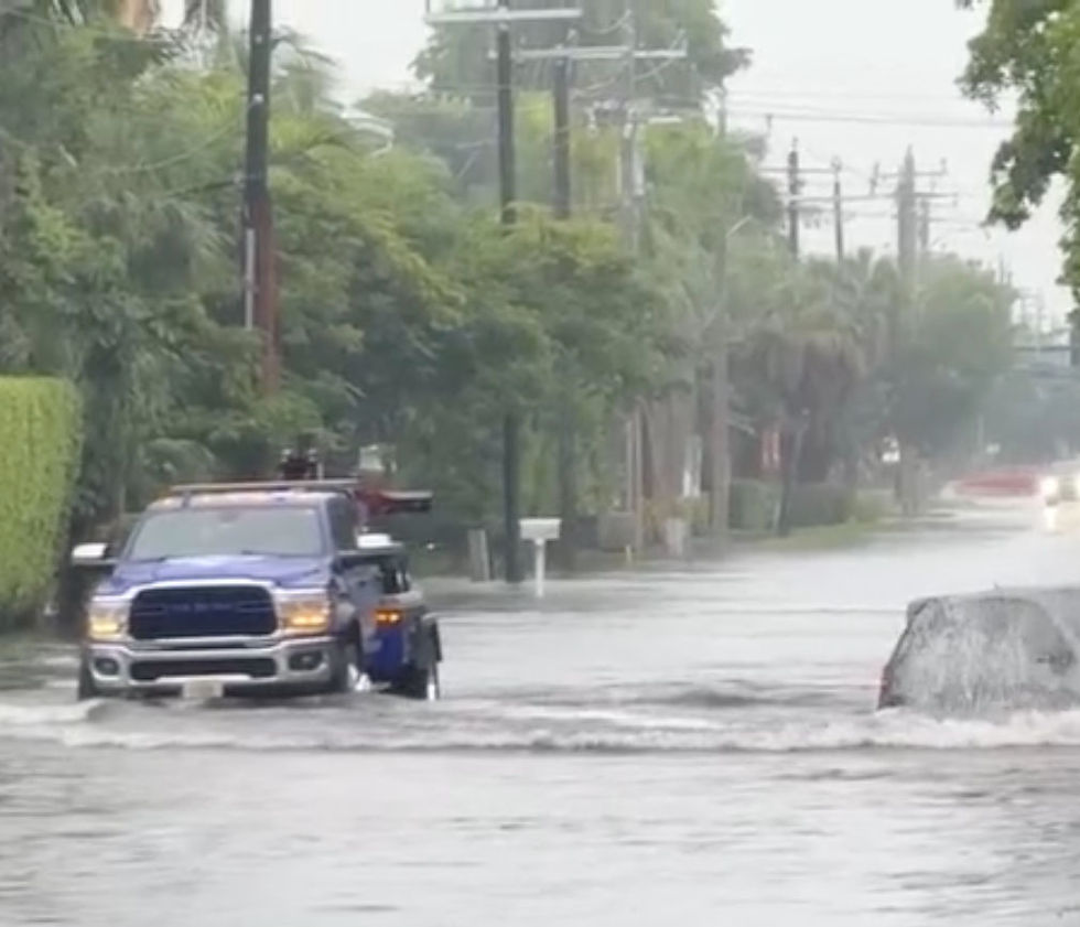 Heavy rain created flooding in Naples, Florida, bringing out tow companies to rescue stranded motorists.