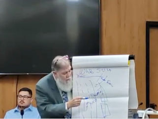 A witness uses a diagram to explain the events surrounding the fatal crash that killed tow truck driver David Zapata in Harlingen, Texas, on July 8, 2025.