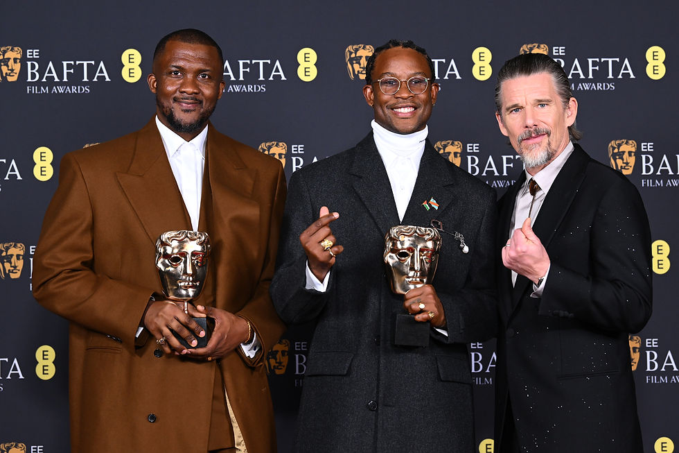 Akinola Davies Jr, Wale Davies with the Outstanding Debut by a British Writer, Director or Producer for 'My Father's Shadow' pose with presenter Ethan Hawke during the EE BAFTA Film Awards 2026