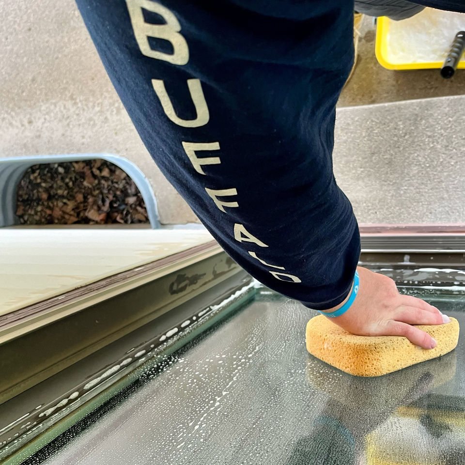 Home hydration cleaning windows with sponge