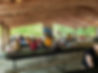 People in an outdoor pavilion