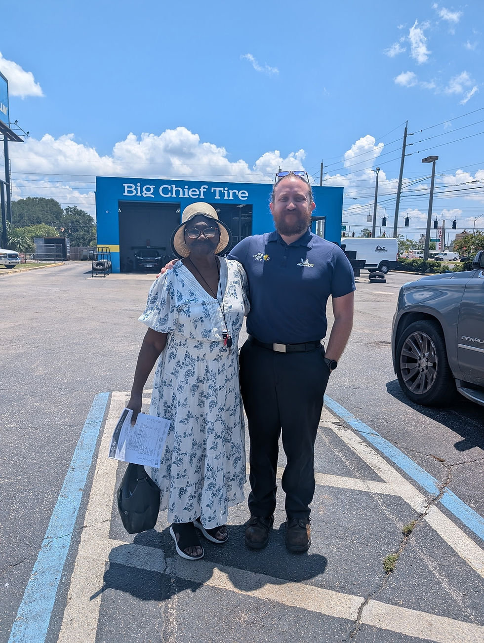 Warrior standing with one of our business partners, big chief tire