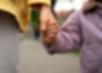 mom and daughter holding hands