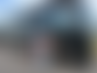 Family standing in front of a luxury Foretravel Motorcoach RV