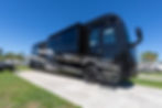 Our A Class A Foretravel motorcoach is parked on the concrete pad with the picnic table towards the back of the coach.