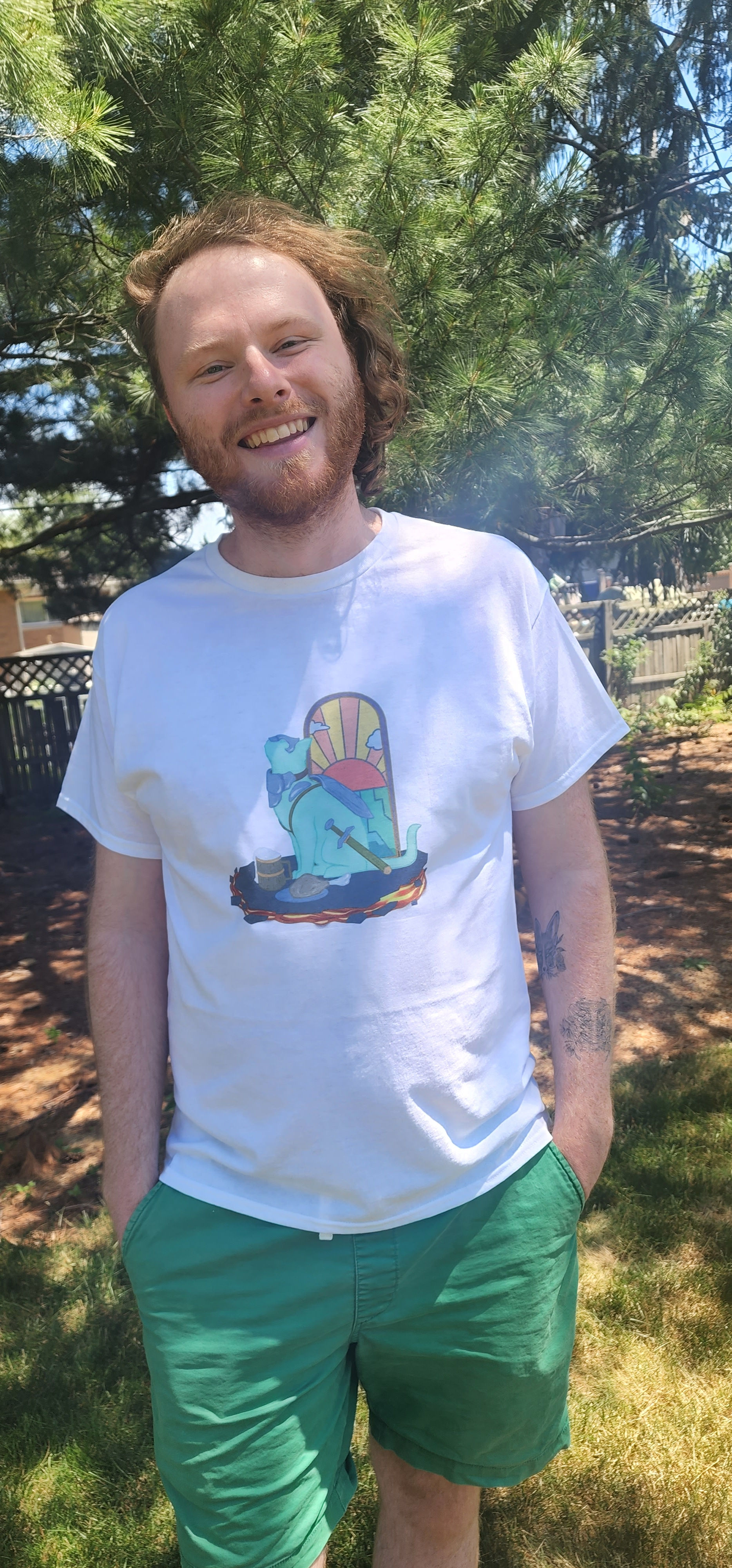 A person wearing a white shirt with a design of a cat that looks like a paladin