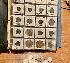 Estate auction items including coin collection at All Seasons Estate Sales Spokane WA.”