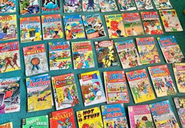 Estate auction items including vintage comics at All Seasons Estate Sales Spokane WA.”