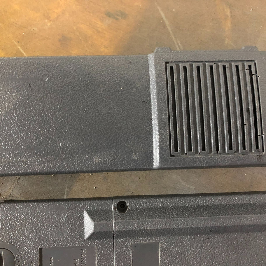 Gray plastic kit on a table Resin Cast Motorola HT220 Radio Kit (Ray Stantz) with screw placements.