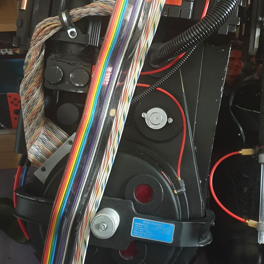 Epic Props logo, GBI Ribbon Cable sign, and Ghostbusters Replica '84/AFTERLIFE Ribbon Cable on display