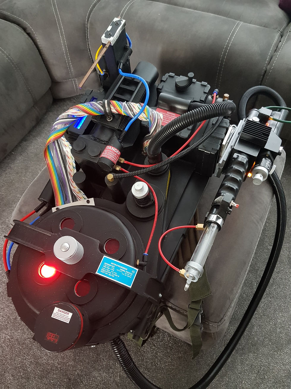Epic Props logo, GBI Ribbon Cable sign, and Ghostbusters Replica '84/AFTERLIFE Ribbon Cable on display