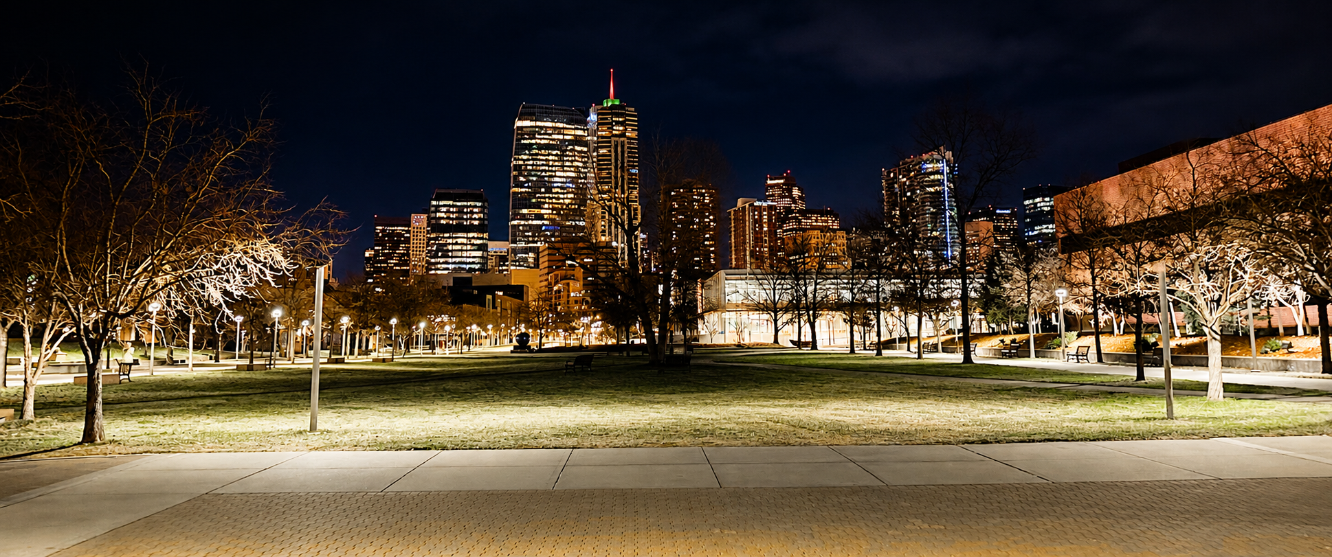 Downtown Denver illuminated at night beyond the Auraria campus.