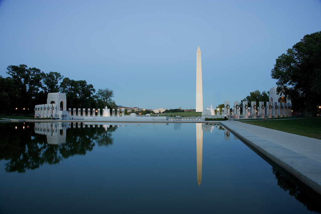 The Washington Monument reflected in the pool beside the World War II Memorial in Washington, DC.