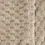 Thumbnail: The beige blanket is very soft to the touch, with a 3D embossed pattern.