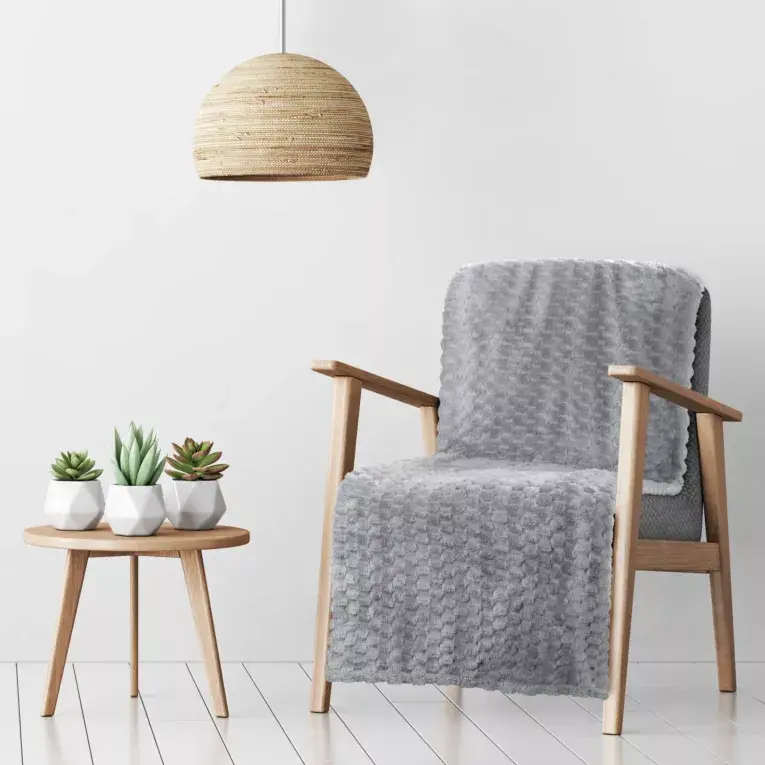 Thumbnail: The blanket is silver, very soft to the touch, with a 3D embossed pattern.