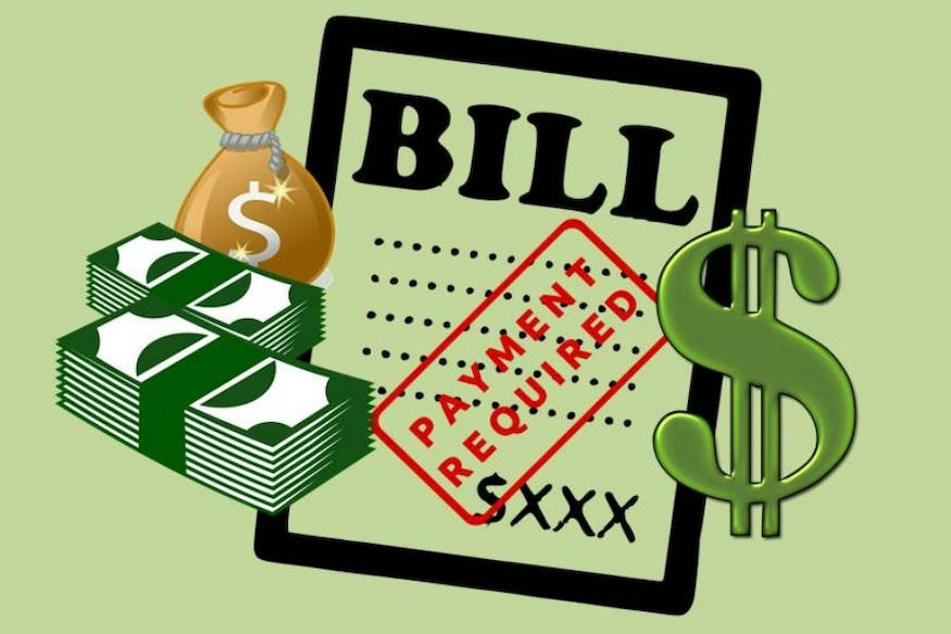 image of stack of money, cash bag, dollar sign, and a paper bill that says "payment required"