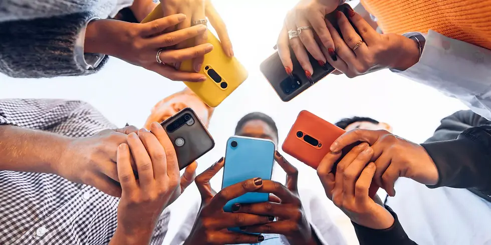 a group of people standing in a circle with their faces covered in smartphones 