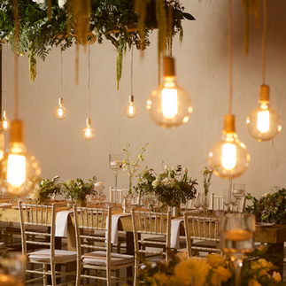 Candlelit winter wedding decor with flickering candles and a warm, romantic ambiance.