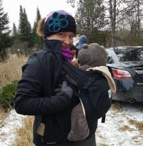 Here’s an example of wearing a baby under the jacket (unzipped), so the baby stays warm.