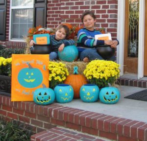 Becky’s two sons pose with their “Tricks” and “Treats” bowls. Photo courtesy of blog.foodallergy.org