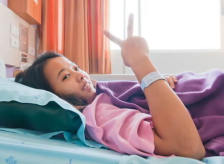 Female patient sowing her two fingers for cheerful.jpg