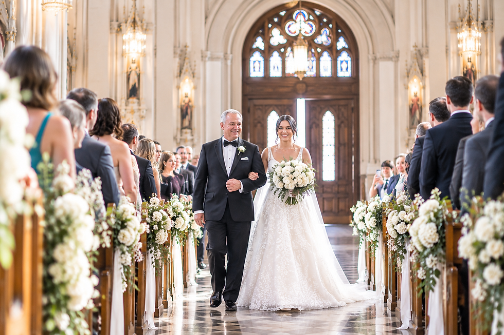 A father walking bride down the aisle during a Catholic wedding