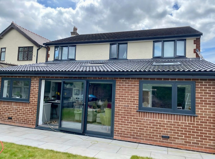 Back of a house complete respray of UPVC windows in black